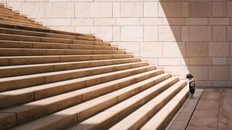 toddler's standing in front of beige concrete stair by Jukan Tateisi courtesy of Unsplash.